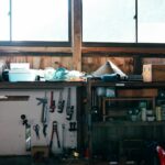 Homeowner performing how to organize and maximize garage storage space task